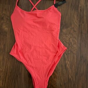 Victoria's Secret "pink island" one piece swimsuit. Size large.